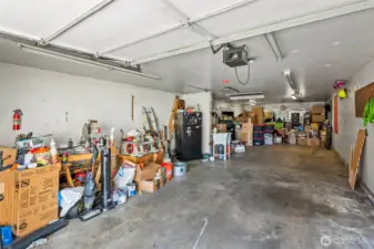 Don't mind the items the sellers are moving but you can see with half the home packed up you can still see how much space this garage really offers.