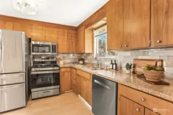 New stainless appliances and refinished cabinets.