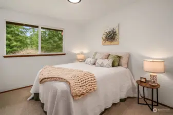 The first of two second floor bedrooms, with a window facing the east.