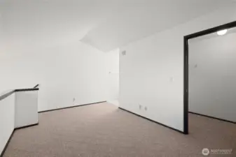 Second floor bedroom showing walk-in closet to the right