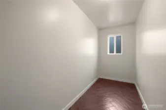 Storage room off kitchen that can be converted to a laundry room or half bath