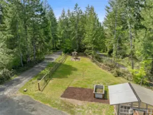Lawn, playground, and raised garden beds