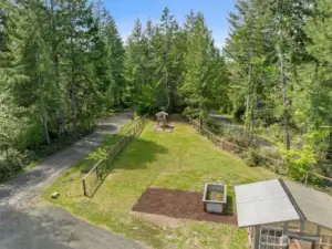 Lawn, playground, and raised garden beds