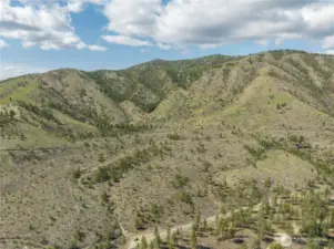 Rolling terrain with flat benches throughout the 522 acres.