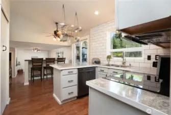 A great space to gather, the second bar offers a nice connection between the kitchen & family room very much an open concept feel.