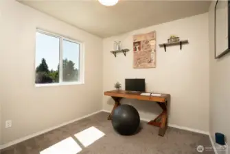 Third of three bedrooms on upper level.