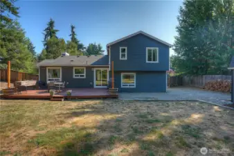 Relax and enjoy your morning coffee in peace and tranquility on your private deck! Load of potential with this great backyard!