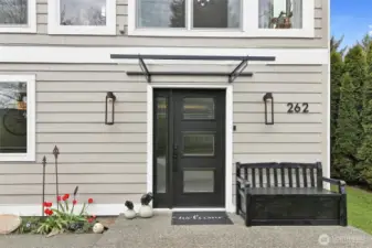 Updated metal and beveled glass front door.