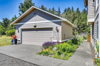 Detached garage with shop space and room for two vehicles.