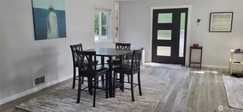 Entry level entry via the metal and beveled glass door to the informal dining area.