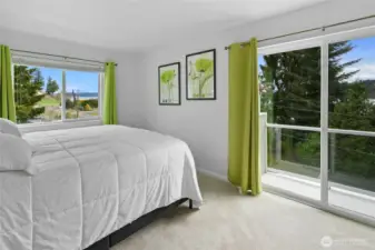 The 3rd floor bedroom with a water view and a full bath just outside the doorway.