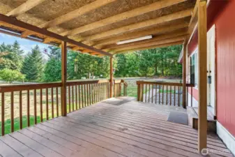 Covered porch with paved walkway.