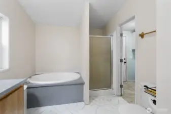 Master bath has a pass through to the laundry room.
