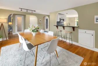 Formal dining with breakfast bar to the kitchen and sliding doors to the backyard deck.