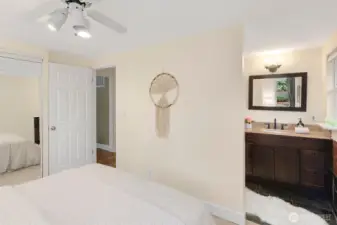 Primary bedroom with ensuite bath and California Closet built-ins.