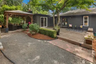 Deck off the living room and dining room, gazebo on the left.