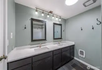 upper level full bathroom with new dual sink vanity, lighting and tiled floors