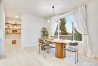 To the left of additional open shelving for overflow storage and walk-in pantry.