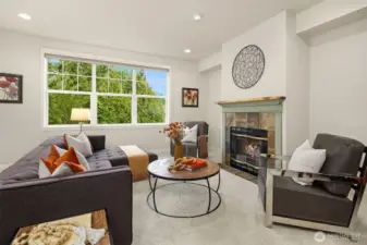 The living room features a gas fireplace.