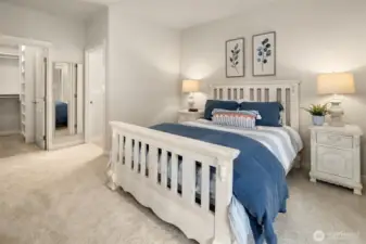 The primary closet is a large walk-in with built closet systems.