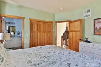 Primary Bedroom with 3/4 Bath, and beautiful doors & trim work.  Radiant wall heaters are infra-red, they sit higher on the wall to circulate the warmth consistently throughout each room!