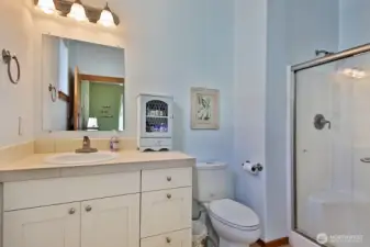 High vanities with custom tile work counters.