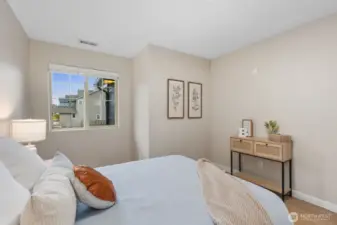 This perspective showcases the room’s open layout and natural light, offering flexibility for a guest room, home office, or additional bedroom setup.