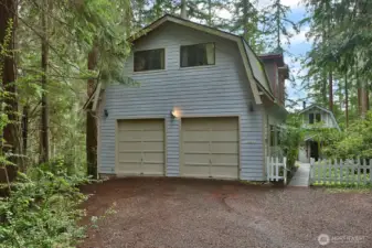 Main home with cabin. Besides of oversize garage, there is plenty of room for parking in the driveway.