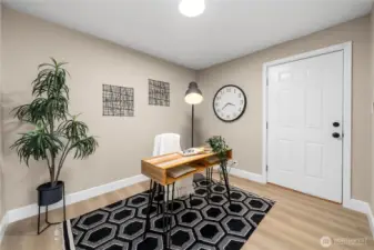 3rd bedroom set up as an office with entry to back yard.