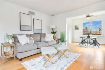 The living room connects easily to the formal dining area, creating a functional, open feel.