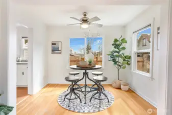 The formal dining room sits just off the kitchen, with windows on two sides that keep the space feeling bright.