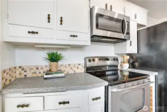 Ample cabinets and drawers provide practical storage for everyday kitchen essentials.