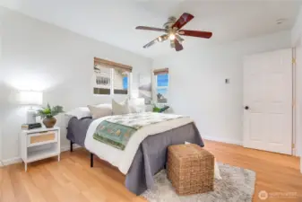 A ceiling fan adds to the home’s overall comfort, with additional fans in the living room, dining room, and second bedroom.