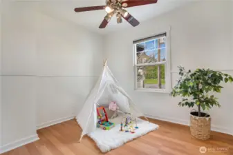 A second bright and cozy bedroom offers a comfortable, inviting space.