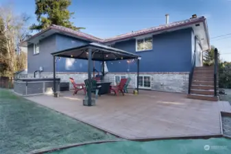 Enjoy the backyard under the gazebo or in the hot tub