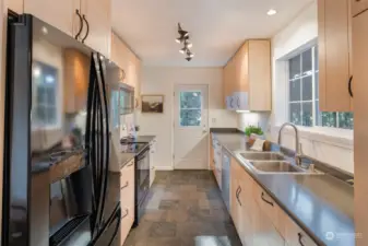 Kitchen with pantry and exterior door to backyard or wrap around deck.