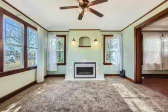 The fireplace. Living room opens to the dining room.