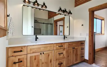 Primary en Suite Bathroom has dual vanity sinks, quartz counters, extra long sinks