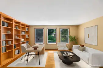 This from room, with custom built in shelving, lends itself to many uses. Virtually staged here to show its versatility.