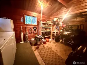 One car garage and utility room in 2nd Pan Abode cabin.