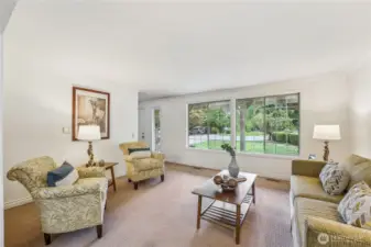 Generous living room with more oversized windows bringing in the natural light