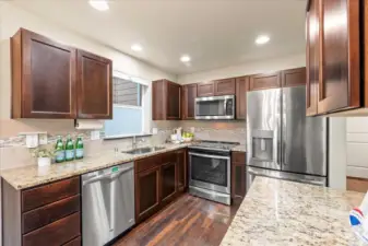 Stainless steel appliances and granite counters.
