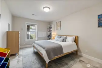 2nd bedroom is virtually staged but has heated floors