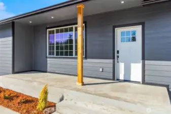 Covered front porch keeps guests warm and dry!