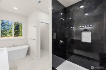 Another view of the primary ensuite, with walk-in-shower and private commode! (also w/ pocket door)