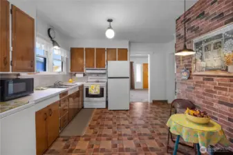 Large kitchen area with new refrigerator.