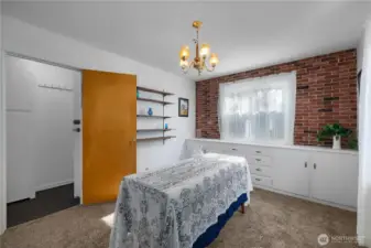 Dining room leading to stairs to basement area.