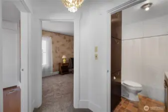 Hall area with doors to full bathroom, 2 bedrooms and office.