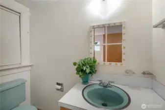 Half bathroom in the primary bedroom.