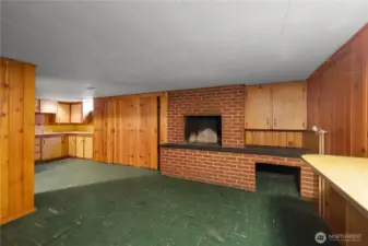 Downstairs basement additional space|hobby room with additional storage and fireplace.